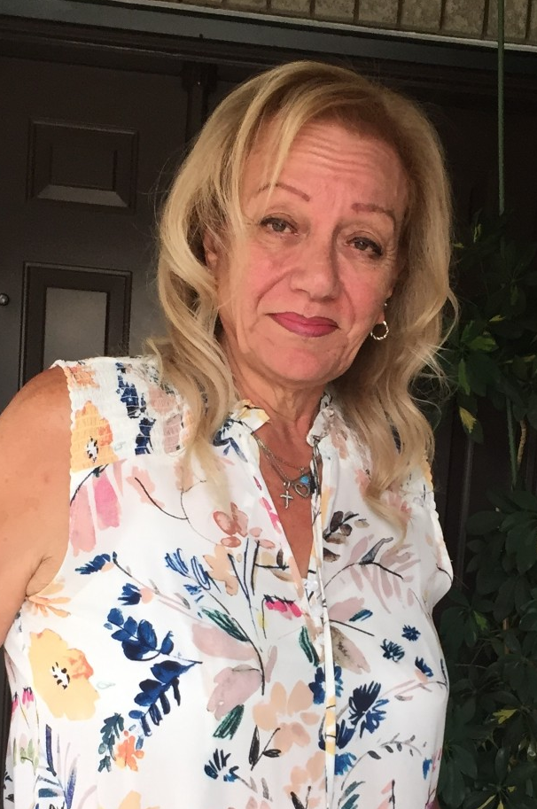 Blond lady with a partial smile