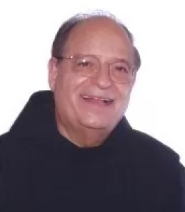 A smiling older man wearing a brown habit