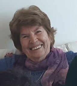 a photo of a kind elderly woman smiling