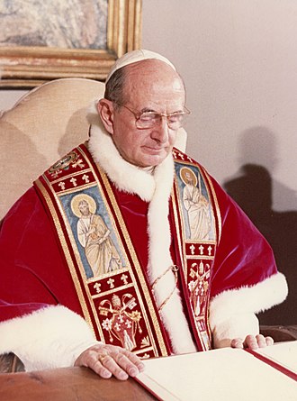 Pope in red regalia with white skull cap