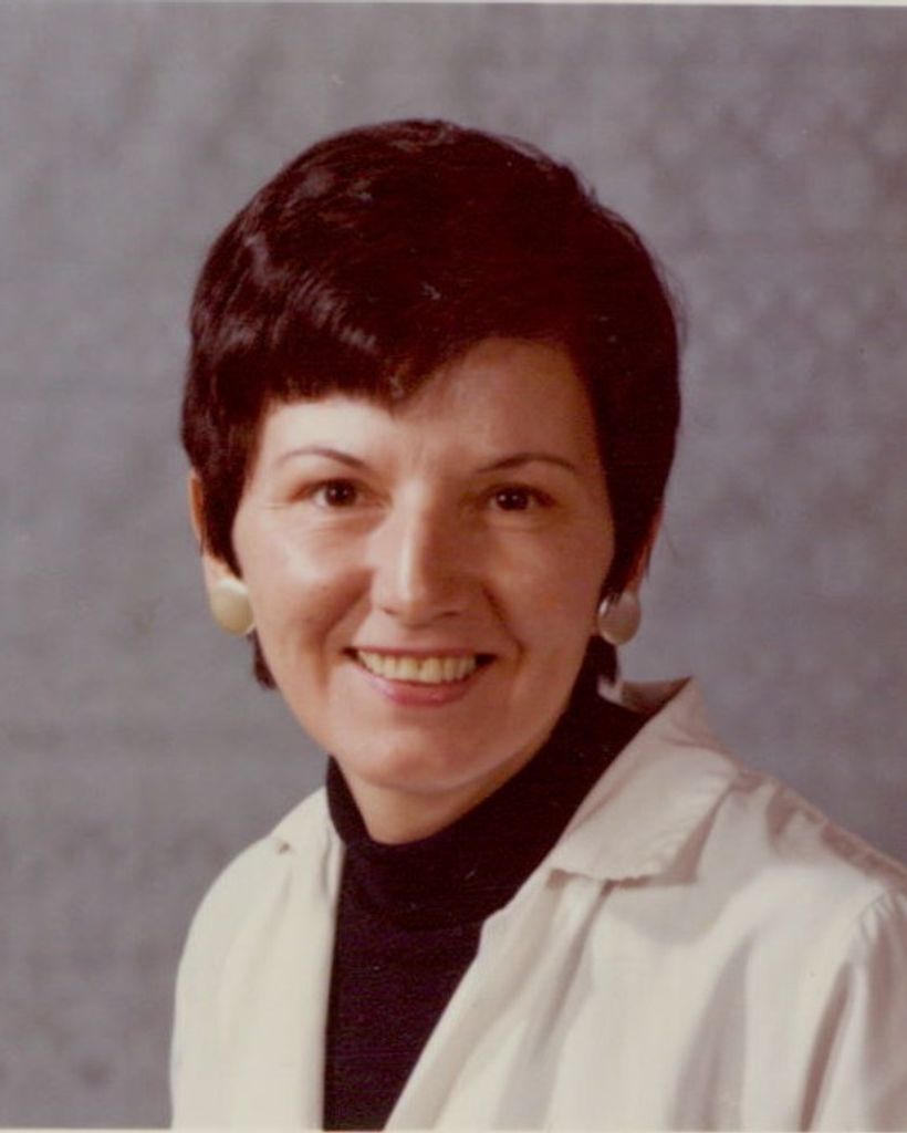 Lady with short brown hair smiling