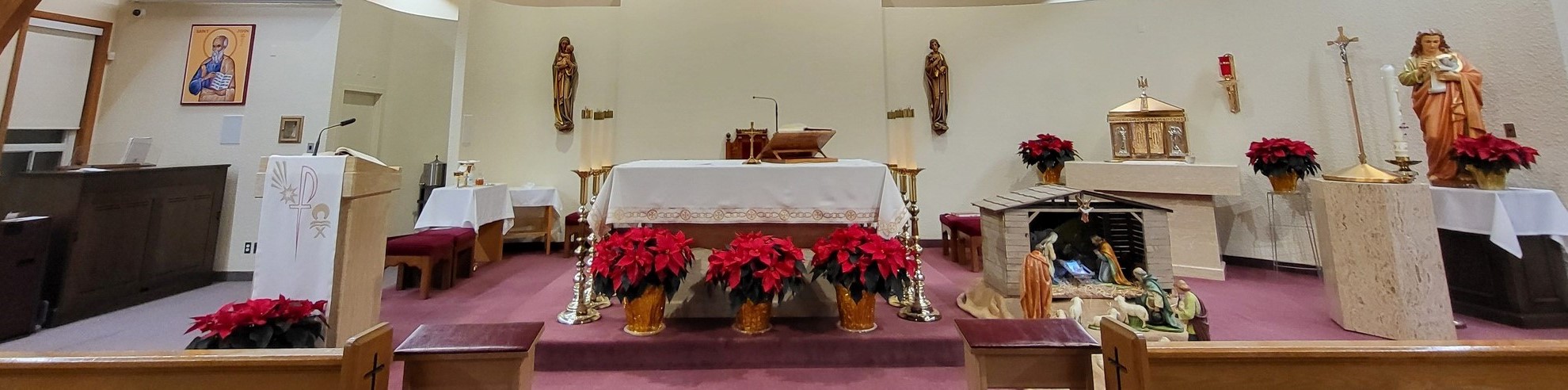 picture of the front sanctuary of church decorated for Christmas