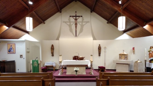 View of the Sanctuary and back wall of St. John the Evangelist Parish Weston.  The picture is taken during ordinary time.