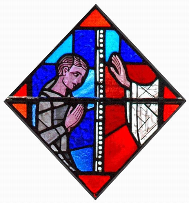 Stained glass of someone at Confession