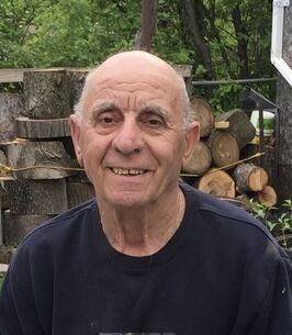 Older man wearing dark shirt